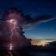 Clear green waves lapped against the white sand. Giant thunderheads rose from the distant horizon, like effervescent volcanoes bursting out of the sea. Forked lightning danced around the tops of...